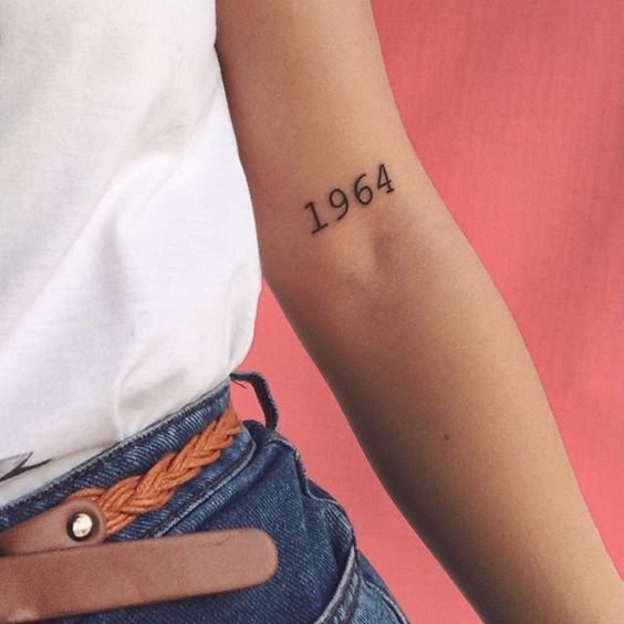 tattoo with date on the forearm