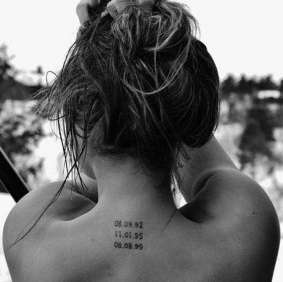 tattoo with dates on back