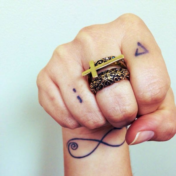 112 finger tattoo