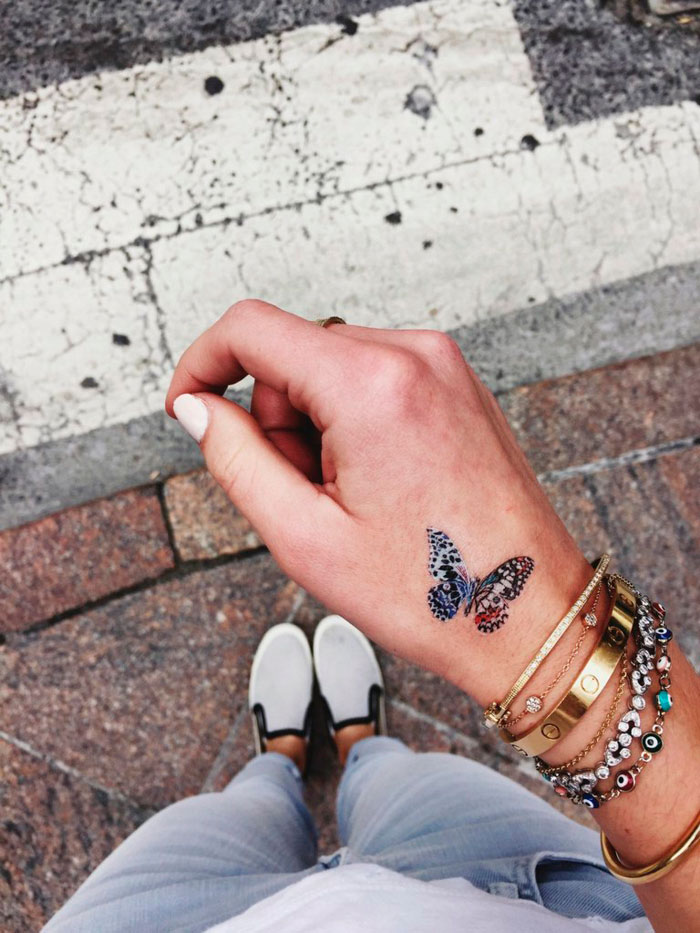 butterfly tattoo on hand