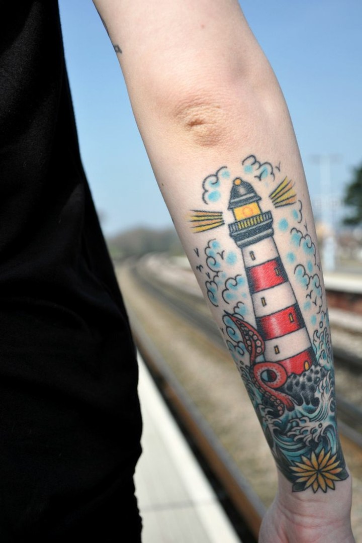 lighthouse-colorful-tattooed-arm