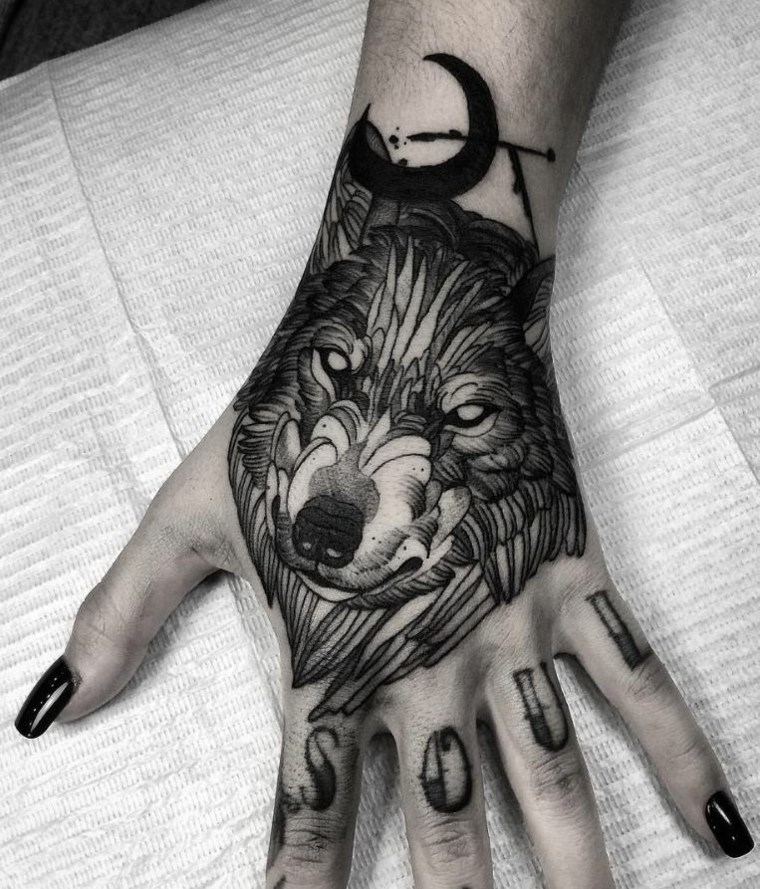 wolf tattoos small-hand-woman