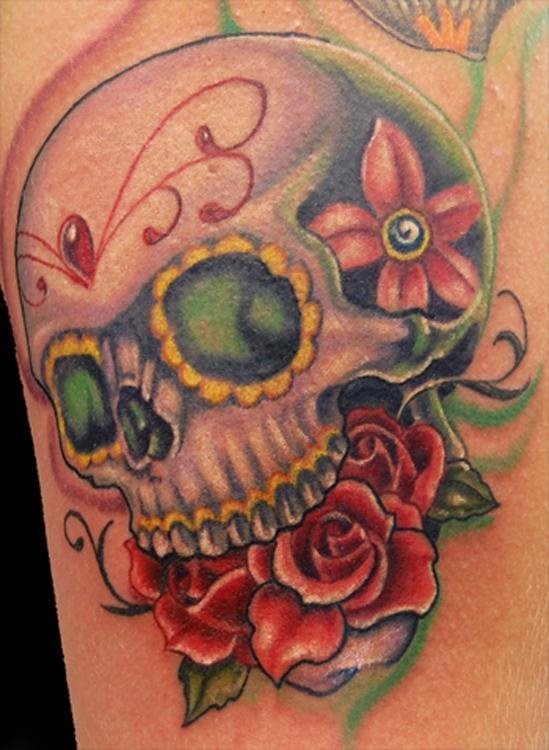 A much more colorful design of a skull adorned with different motifs and that uses striking colors