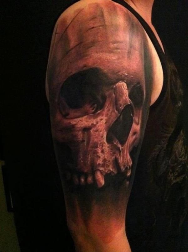 Dark design of a skull that covers most of the arm