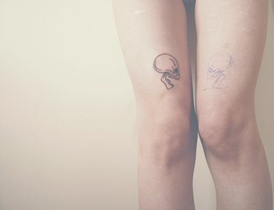 This girl has a simple little skull on her thigh