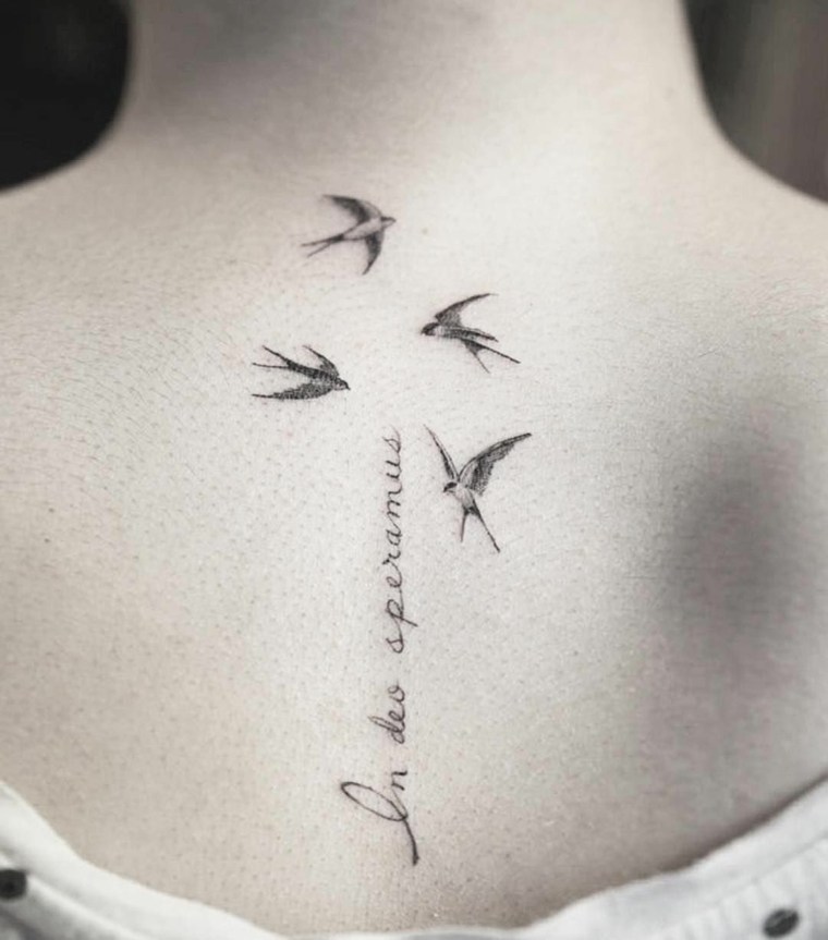 small tattoos-birds-back-woman