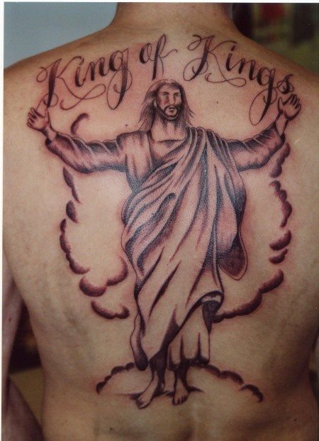 Jesus tattoo with great robe and open arms on which the word has been tattooed 