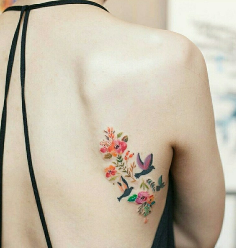 tattoo of flowers and birds