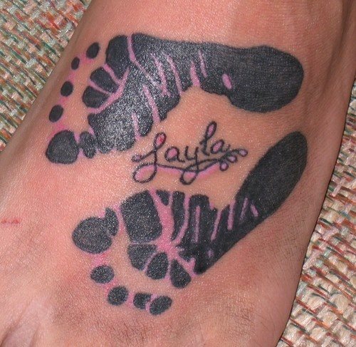 Footprint tattoo on another foot