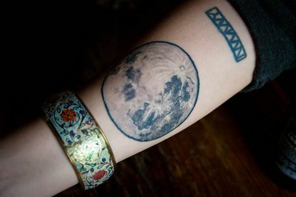 Model 137 forearm tattoo