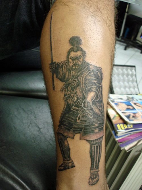 Defeated warrior tattooed on the arm