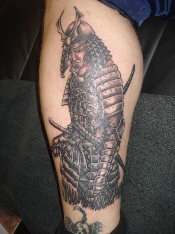 Tattoo of a warrior on the leg