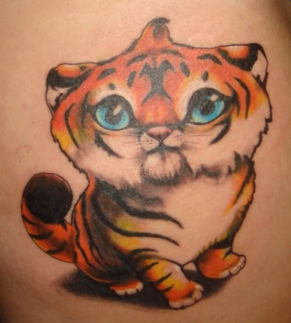 Funny tattoo of a tiger with a childlike look and even lively big blue eyes