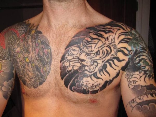 Two large designs on both sides of the chest and each occupying one arm