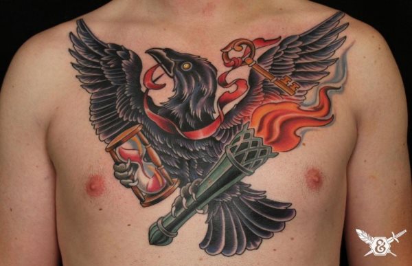 Tattoo of a black eagle on the chest and the eagle accompanied by a bow on the neck with an old key, on one of its legs it carries an hourglass and on the other it grabs a large torch, which has been tattooed little smoke